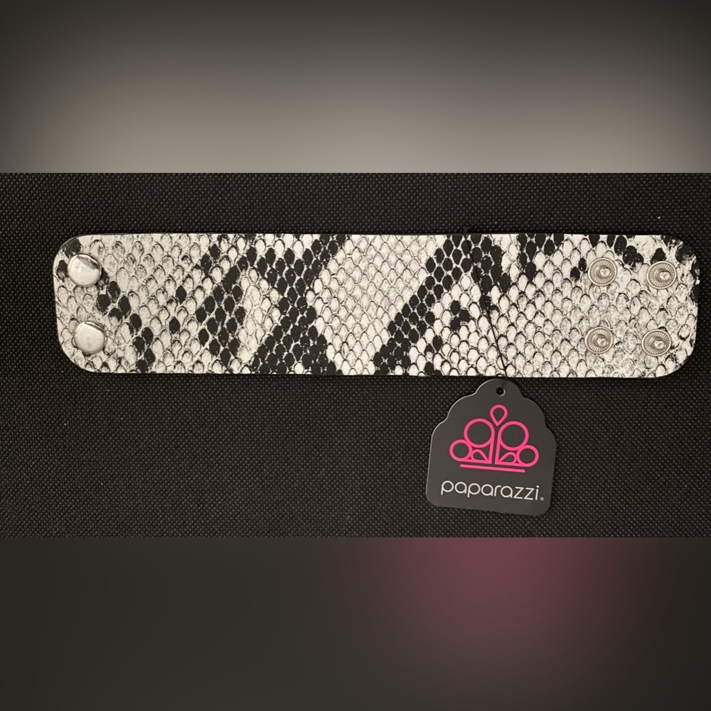Thick black and white snake pattern wrap bracelet.